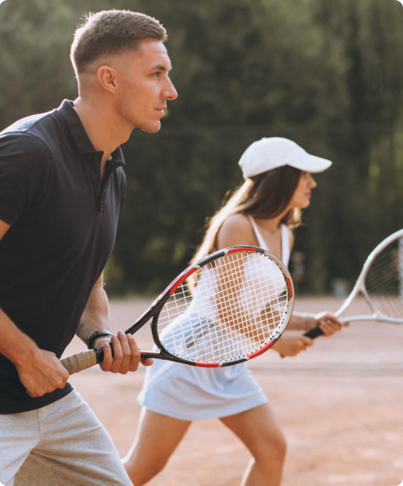 tennis players taking a lesson